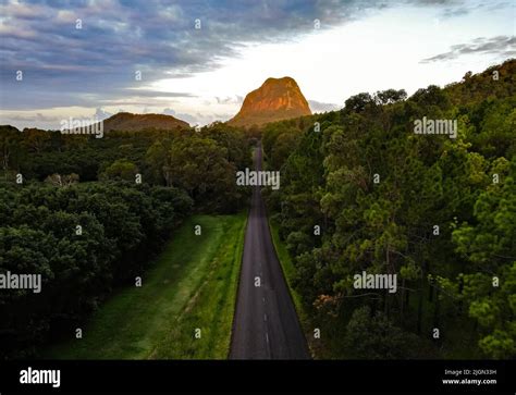 An aerial photography of Mount Tibrogargan glowing red at sunset Stock ...