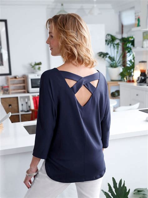 This Criss Cross Back Top is so cute for spring. We just love the open ...