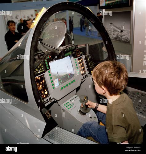 A young boy sits in BAE Systems Typhoon model cockpit Stock Photo - Alamy