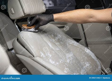 A Man Cleaning Car Interior By Use Foam Chemical And Scrubbing Machine ...