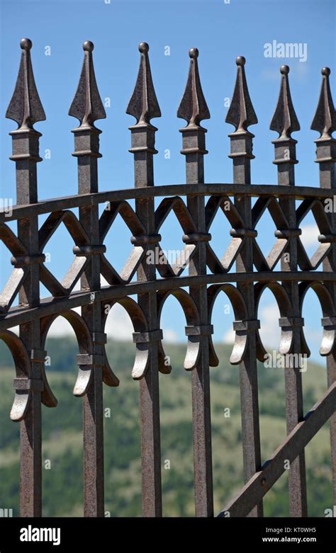 Black decorative metal fence with spikes Stock Photo - Alamy