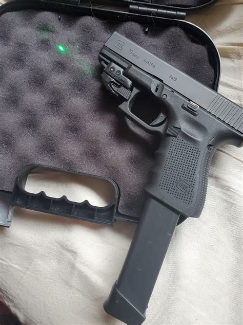 My Glock 19 Gen 4 w/ Crimson Trace green laser & 33 round extended ...