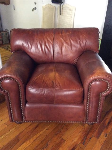 Revamp: Brown Leather Cigar Chair by Robinson & Robinson.