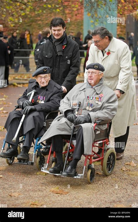 disabled war veterans and old soldiers in wheelchairs wearing berets ...