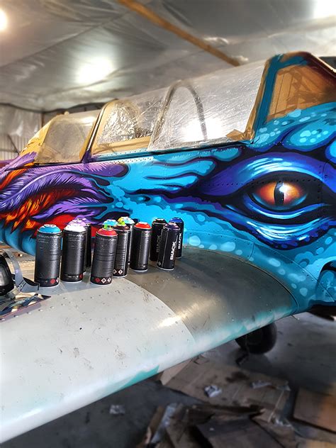 graffiti airplane dragon takes to the skies (a spray painted yak 52)