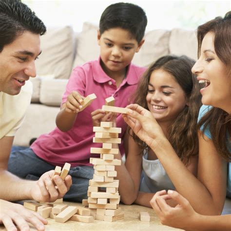 Family Playing Game Together At Home - Crossroads Family Counseling Center