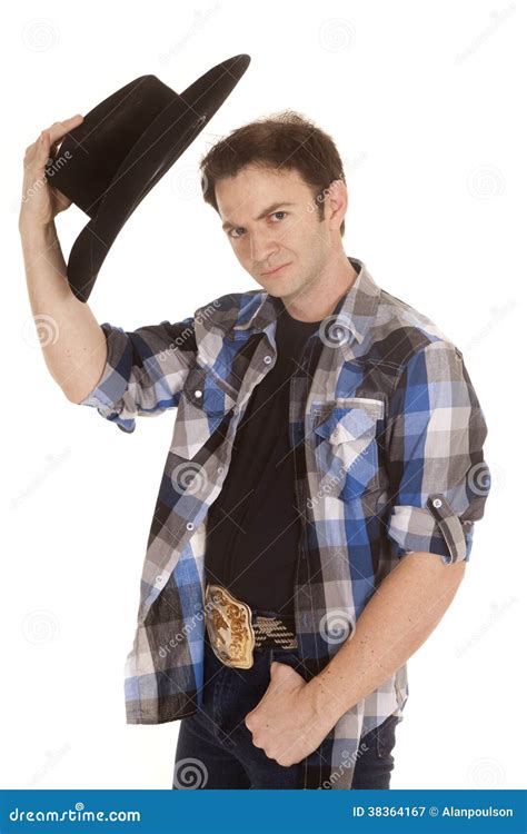 Cowboy With Black Hat In Hand By Head Stock Image - Image: 38364167