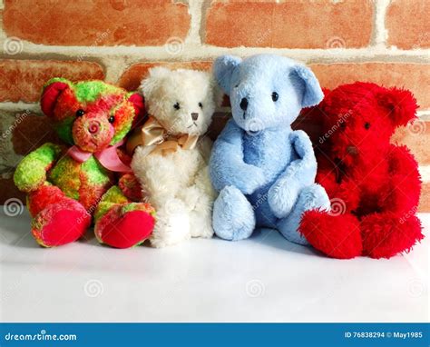 A Group of Cute Teddy Bears Sitting Together Against with Wallpaper ...