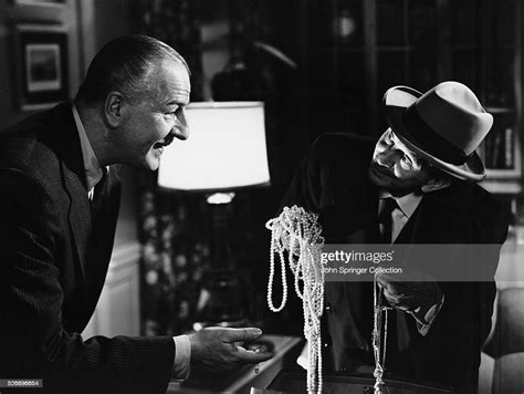 Louis Calhern , as Alonzo D. Emmerich, and Sam Jaffe , as Doc Erwin ...