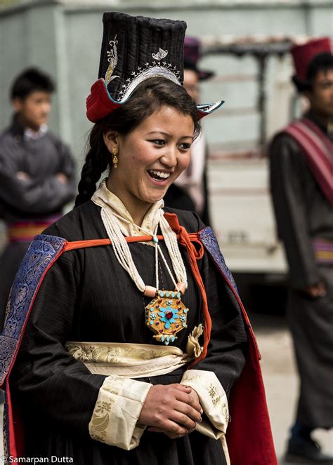 A smiling Ladakhi girl in traditional costume at the Ladakh festival in ...