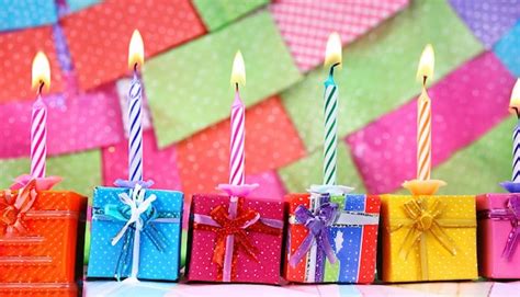 Premium AI Image | A bunch of birthday candles with a gift box in the ...