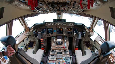 The Boeing 747-8JK cockpit is filled with pretty buttons and switches