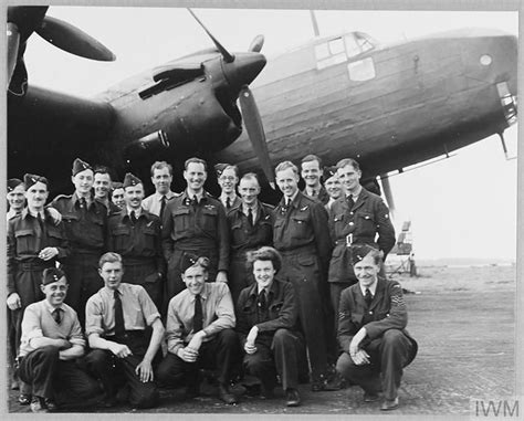 Original wartime caption: Squadron Leader Bainbridge, DFC., with his ...