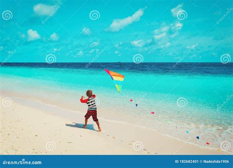 Little Boy Flying a Kite on Beach Stock Image - Image of outdoor, kite ...