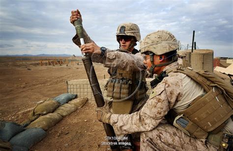 Mortarmen fire a 60mm mortar. | Stocktrek Images