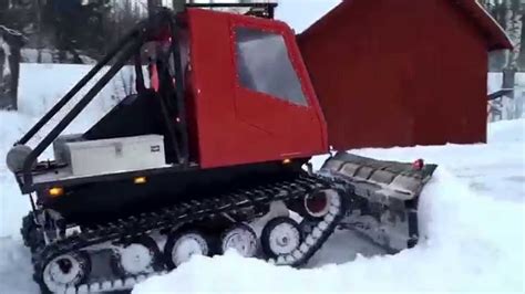 Homebuilt tracked vehicle snow plowing - YouTube