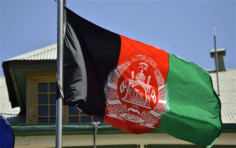 The Afghanistan flag is shown blowing in the wind over International ...