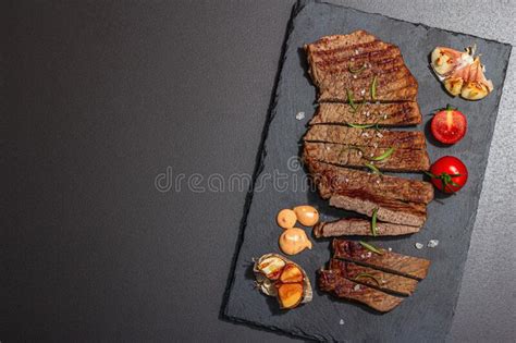 Well Done Roasting Veal Steak with Sauce, Rosemary and Grilled Garlic ...