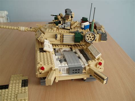 a toy tank made out of legos on a table