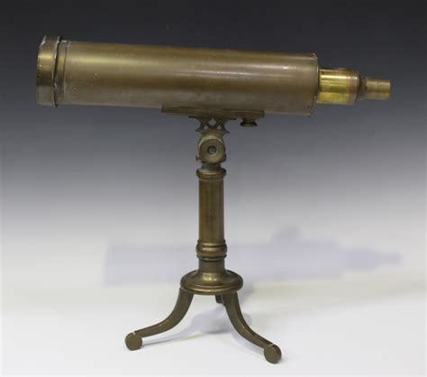 A late 19th century brass telescope, the 31cm body tube with rack and ...