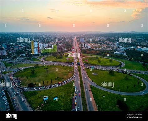 An aerial view of a multiple lane highway road with traffic at sunset ...