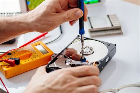 Technician Repairing Broken Hard Disk Drive. Stock Image - Image of ...