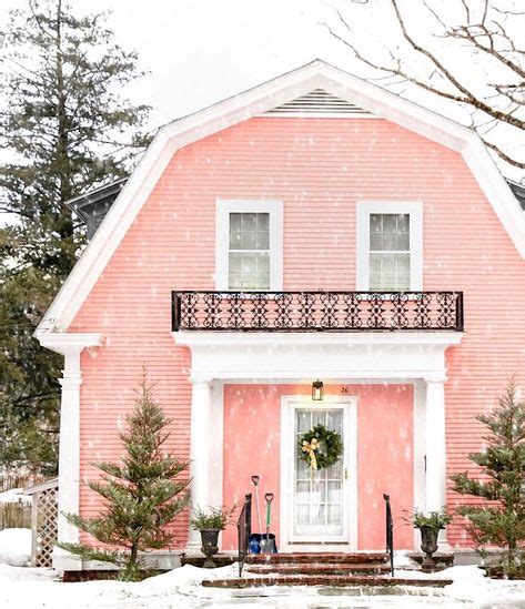 I love this bright pink farmhouse tucked away in the woods! The snow ...