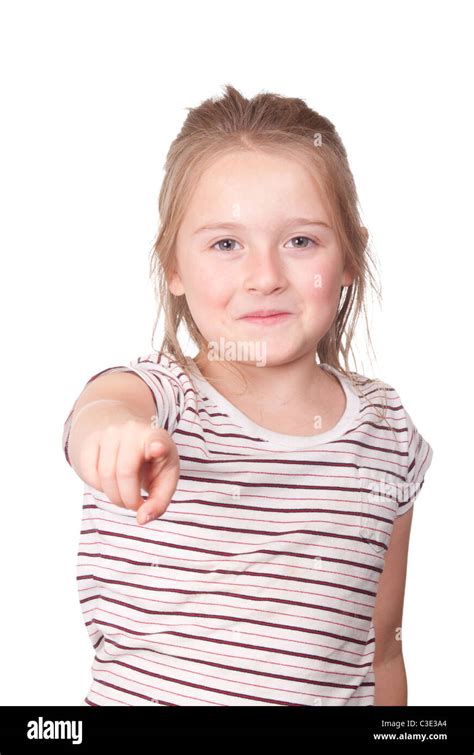 A photograph of a young girl pointing at something with a smirk on her ...