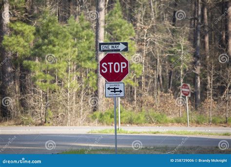 One Way, Stop, and Divided Highway Signs Editorial Photo - Image of ...