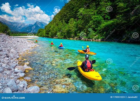 Sporty Kayakers on the Beautiful Turquoise Soca River, Bovec, Slovenia ...