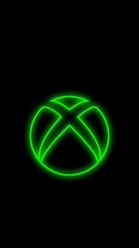 the xbox logo is glowing green in the dark