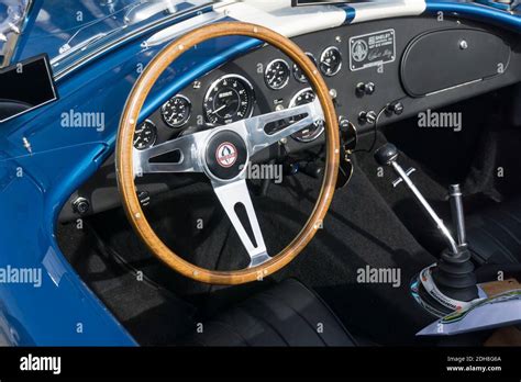 Close up detail of the interior, dashboard and steering wheel of a blue ...