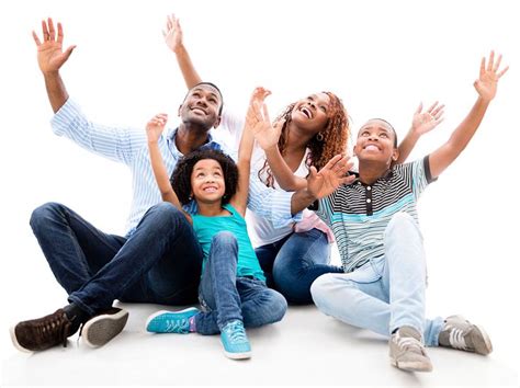 Happy black family with arms up - isolated over a white background ...