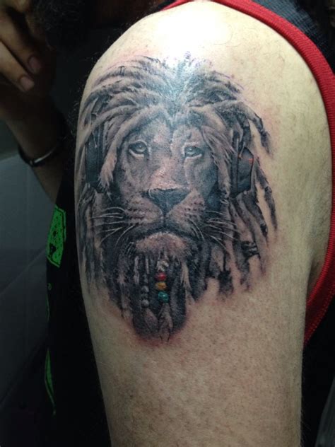 a man with a lion tattoo on his arm