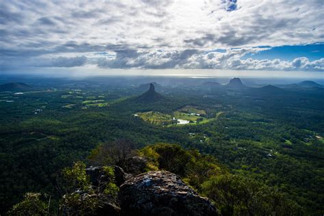 Overlooking the Glasshouse mountains from the summit of Mt Beerwah ...