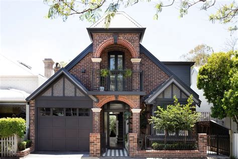 Stunning Brick House with Yellow Shutters: Take a Peek Inside!