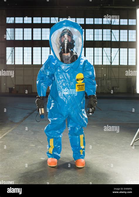 A National Guardsman wears a Nuclear radiation suit during training at ...