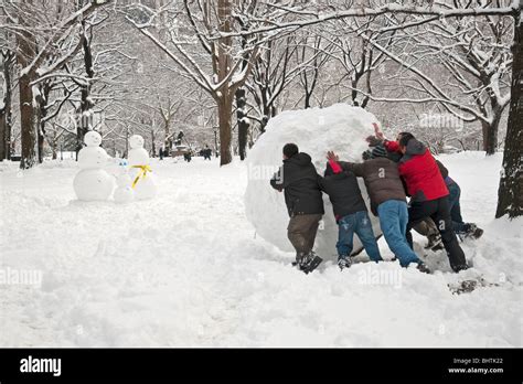 People Building a Snowman in Central Park during record snowfall on ...