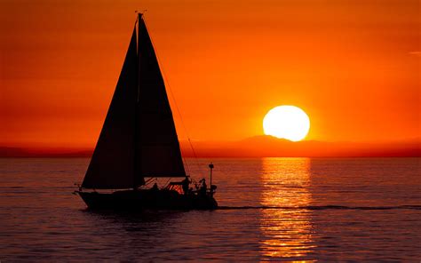 Sailboat Sunset Photograph by Alexis Birkill - Pixels