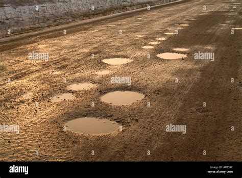 Road With Potholes Stock Photos & Road With Potholes Stock Images - Alamy