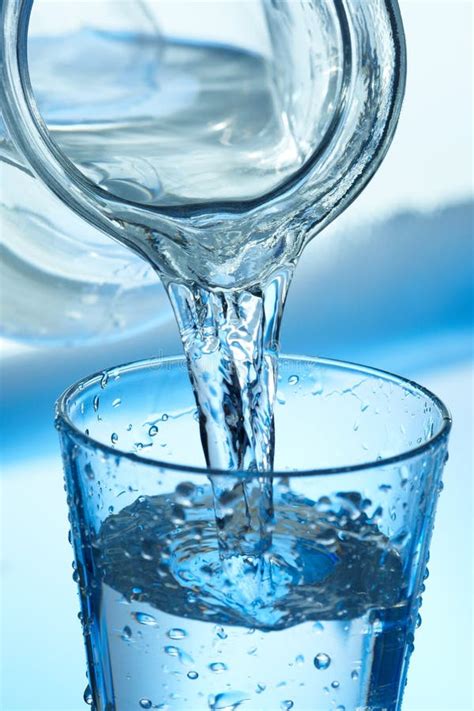 Pouring Water into a Glass. Stock Photo - Image of pouring, close: 24151478