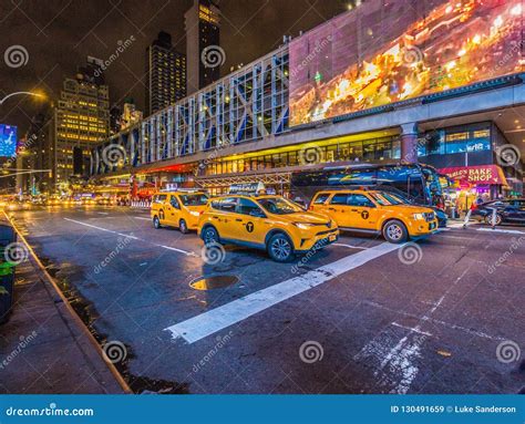 Yellow New York Taxis on the Street at Night in NYC Editorial Stock ...