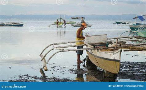 Local Fishermen with Fishing Boat at the Port of Tubigon on the ...