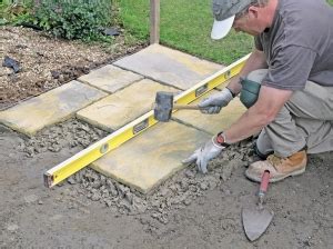 Lay paving slabs on a patio. How to lay paving slabs with our simple ...