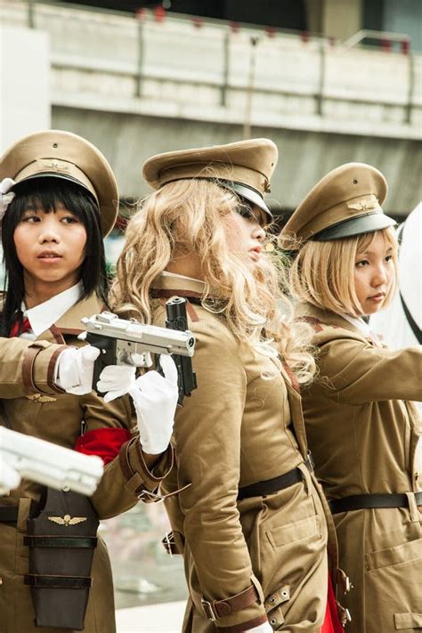 A Group of Young Girls Dressed in Military Costume Participate in a ...