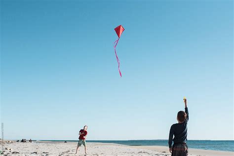 "Boy Flying A Kite On The Beach" by Stocksy Contributor "Léa Jones ...