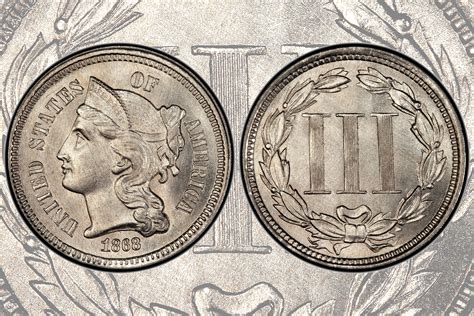 two silver dimes, one with the head of a woman and one with a wreath on