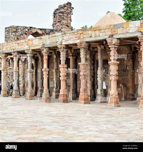 Inside the Qutub Minar Complex with antic ruins and inner square ...