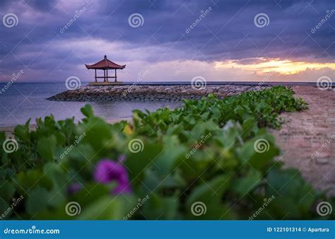 Sunrise in Cloudy Morning at Sanur Beach with Pavilion and Ornamental ...