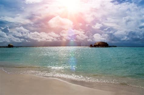 Maldives. the Turquoise Sea in Sunshine and the Wooden Bridge Over ...